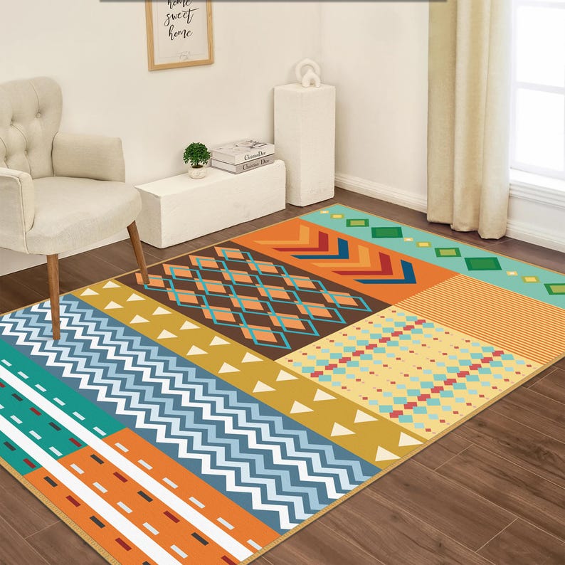 May include: A rectangular area rug featuring a vibrant patchwork design with various geometric patterns including zigzags, diamonds, stripes, and triangles in shades of orange, blue, teal, brown, yellow, and red, arranged in distinct horizontal sections.