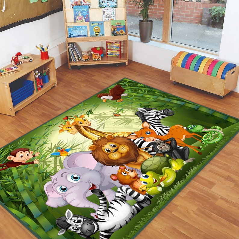 May include: A green jungle-themed rug with a variety of animals including a lion, zebra, elephant, giraffe, monkey, and turtle. The rug is perfect for a child's playroom or bedroom.