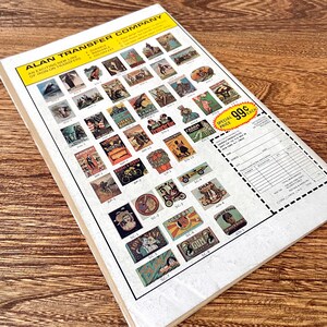 May include: A sheet of iron-on transfer designs for clothing. The sheet features a variety of images, including a ship, a car, a bicycle, a dog, a cat, and a gum wrapper. The text "ALAN TRANSFER COMPANY" is printed at the top of the sheet. The text "SPECIAL PRICE 99&cent; EACH" is printed in the bottom right corner of the sheet.