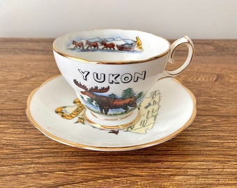 Queen Anne Souvenir Teacup and Saucer, Yukon, Canadian Territory, Moose, Dog Sled, Mountie and Wildlife, Yukon Map, Fine Bone China, England