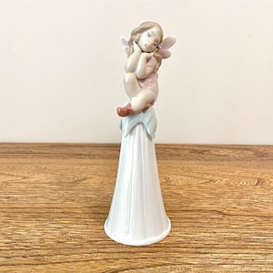 LLADRO ベル It's a girl LLADRO ベル It's a girl Amazon.com: LLADRÓ Spring Girl Figurine