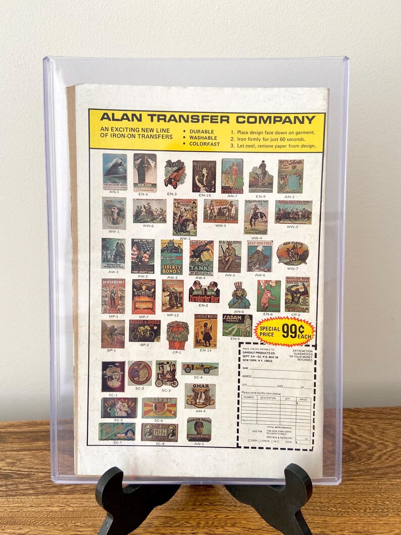 May include: A sheet of iron-on transfer designs featuring various images, including a cowboy, a tank, a car, and a gum advertisement. The sheet is labelled "Alan Transfer Company" and includes instructions for applying the transfers. The price is listed as 99 pence each.