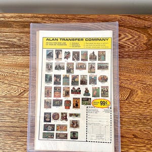 May include: A sheet of iron-on transfer designs featuring various images, including a cowboy on horseback, a car, a tank, and a gum dispenser. The sheet is labelled "Alan Transfer Company" and includes instructions for applying the transfers. The price is listed as 99 pence each.
