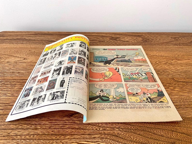 May include: A vintage comic book featuring Tweety Bird and Sylvester the Cat. The cover features a black and white illustration of Tweety Bird and Sylvester the Cat in a train carriage. The comic book is titled "The Great Train Robbery".