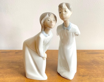 Vintage NAO by Lladro Porcelain Figurines Boy and Girl Kissing Goodnight #4869, #4873, 1970s Spain, Pair of Collectible Statues