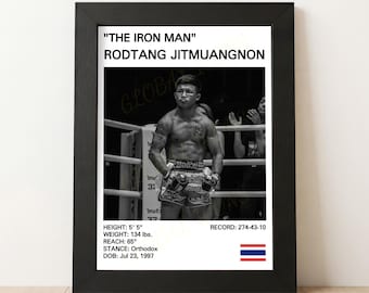 May include: Black and white framed print featuring Rodtang Jitmuangnon, nicknamed "The Iron Man." The print includes his height of 5' 5", weight of 134 lbs, reach of 65", and record of 274-43-10. The Thai flag is at the bottom.