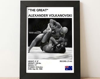May include: A framed black and white print featuring a mixed martial arts fight scene. The print includes the text "THE GREAT" ALEXANDER VOLKANOVSKI, with his height at 5' 6", weight at 145 lbs, and a reach of 71". The record is 27-4-0.