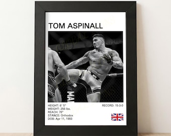 May include: Black and white framed print featuring Tom Aspinall in a UFC fight. The print includes his name, height (6' 5"), weight (256 lbs), reach (78"), stance, date of birth, and record. The print has a black frame.