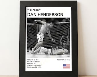 May include: Black and white framed print featuring a mixed martial arts fight scene. The print includes the text "HENDO" DAN HENDERSON, height 5' 11", weight 185 lbs, reach 74", and record 32-15-0. An American flag is also included.