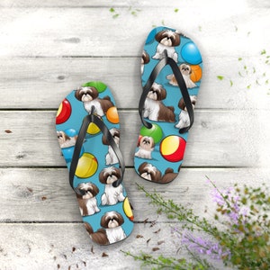 Shih tzu dogs on a beach as a cartoon with beach balls summer flip flop thong, rescue dog lover gift idea, fun pet flip flop.