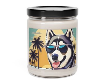 May include: A white candle jar with a black lid and a colorful label featuring a cartoon husky wearing sunglasses in front of a sunset and palm trees.