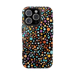 May include: A black phone case with a colourful polka dot pattern. The design features a variety of dot sizes and colours, including orange, yellow, blue, and purple. The case has a glossy finish and a camera cutout.