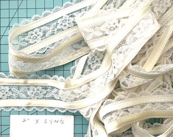 5 yards of lace and satin ribbon lace. 2” wide. Ivory color