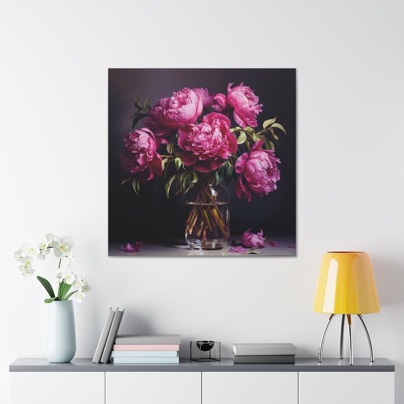May include: A bouquet of vibrant pink peonies arranged in a clear glass vase with a dark background. The peonies are in full bloom and have a soft, delicate texture.