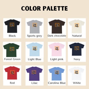 May include: A colour palette of 12 t-shirts with different colours and a graphic print. The colours are black, sports grey, dark chocolate, natural, forest green, light blue, light pink, navy, red, lilac, Carolina blue, and white.