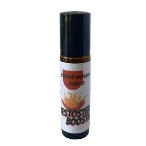 May include: A small, clear glass bottle with a black roll-on top. The label is white with red and orange flames and a red chili pepper. The text on the label reads "Edens Herbal Roots Testoster Booster."