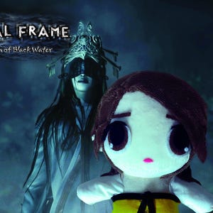 May include: Image features a plush doll with large eyes, brown hair, and a yellow and black outfit. Behind the doll is a figure in a white robe and a blindfold. The text "FATAL FRAME Maiden of Black Water" is at the top.