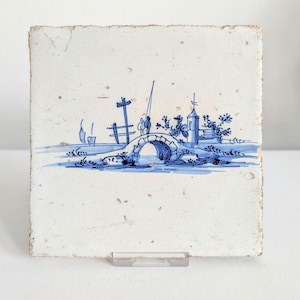 Nice 17th century Delft tile persons on a bridge w church in a landscape Dutch antique blue white wall tiles antique delftware kitchen tiles