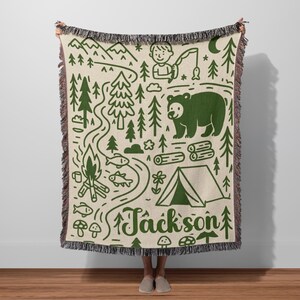 Personalized camping adventure woven blanket with mountains, bear, campfire and forest illustration, woodland nursery decor with custom name Jackson.
