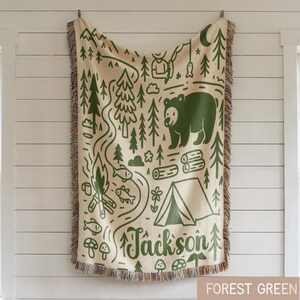 Personalized camping adventure woven blanket with mountains, bear, campfire and forest illustration, woodland nursery decor with custom name Jackson.