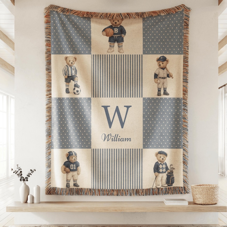 Vintage baby boy nursery blanket with teddy bears in classic sports outfits and custom monogram name design in neutral blue tones.
