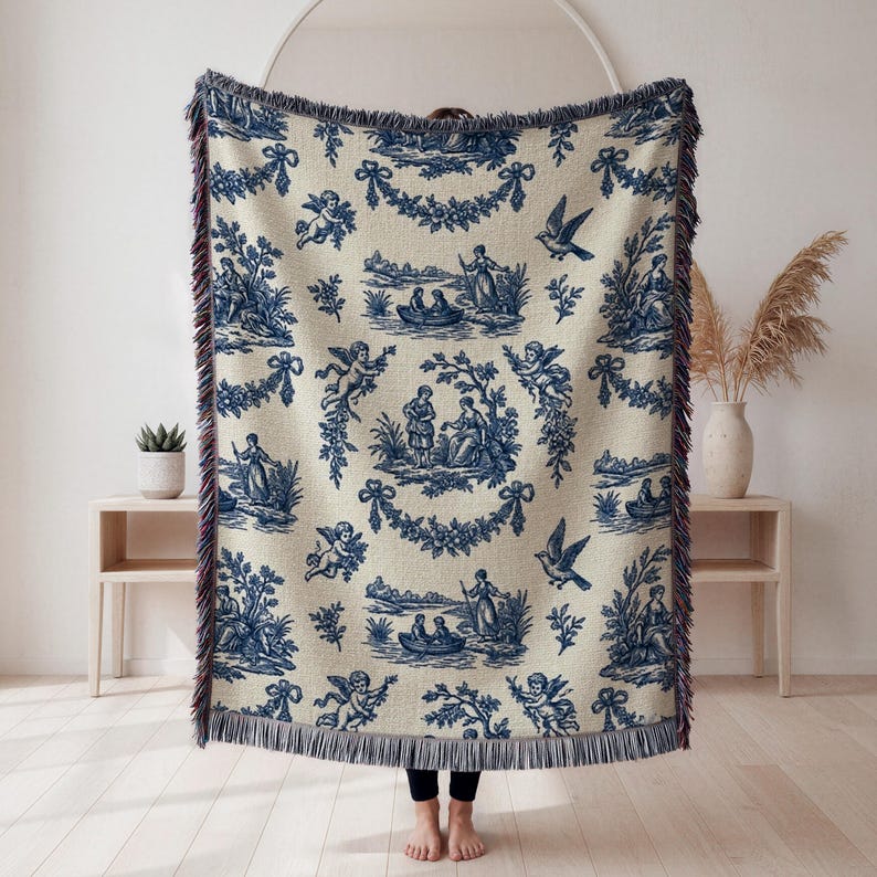 Vintage navy and cream toile throw with romantic European artwork, woven fringe blanket for cottagecore home decor.
