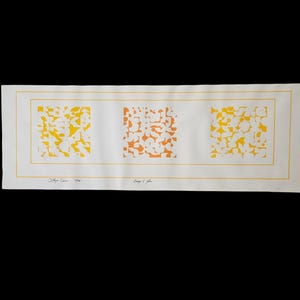 May include: A rectangular print with three abstract squares in yellow and orange hues. The print is on white paper with a yellow border. The text "J. Meyer Caine" and "Orange & Yellow" are visible.
