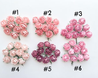 May include: Six bunches of paper roses in various shades of pink and burgundy. Each bunch is labeled with a number from 1 to 6.
