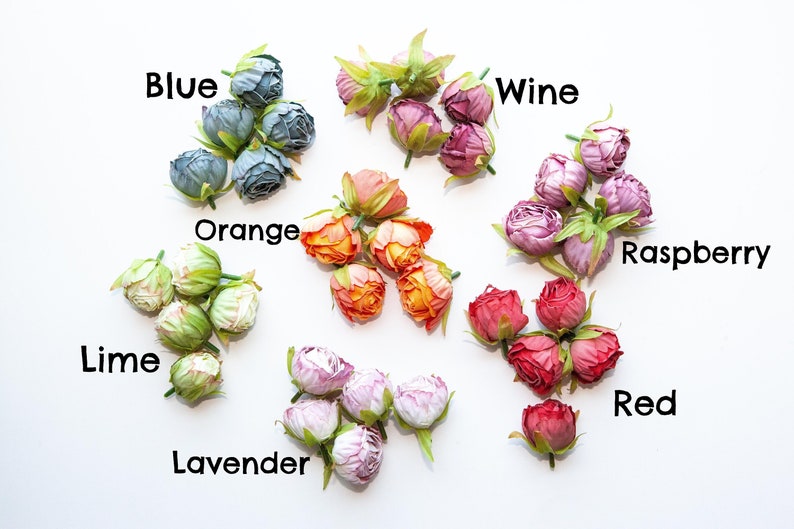 May include: Assortment of artificial rose buds in various colors, including blue, orange, lime, lavender, wine, raspberry, and red. Each color is labeled with its name.