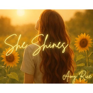 May include: A woman with long, wavy red hair stands in a field of sunflowers. The sun is setting in the background, and the text "She Shines" is written in yellow across the image. The text "Amy Rice" is written in yellow in the bottom right corner of the image.