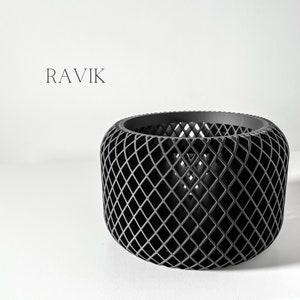 May include: Black, cylindrical, wire mesh planter with a diamond pattern. The planter is empty.