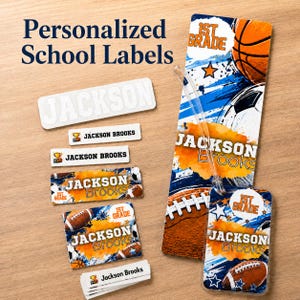 May include: A collection of personalized school labels featuring sports themes, including basketball, football, and soccer motifs. The labels display the name Jackson Brooks and the text 1st Grade, with various rectangular and tag shapes included.