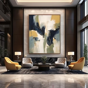 May include: A large abstract painting with a gold frame hangs in a contemporary interior. The artwork displays broad strokes of navy, yellow, and white. Four armchairs in yellow and grey surround a dark coffee table, creating a stylish seating area. Two lamps provide soft lighting.