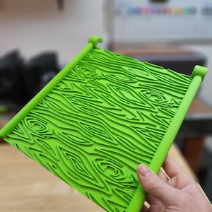 May include: A white ceramic mug with a black handle and the text "But First, Coffee" in a black, bold font. The mug is on a white surface. The mug is approximately 4 inches tall.