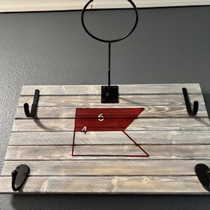 Custom Cavalry design and display holder for hat, spurs, and saber.