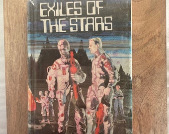 Exiles Of The Stars de Andre Norton ilustrado por Michael Jackson 1972 Libro de ciencia ficción de tapa dura con sobrecubierta Ex Biblioteca