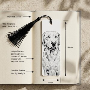 May include: A white rectangular bookmark featuring a detailed black and white illustration of a dog. The bookmark includes a black tassel, measures 150 mm in height by 50 mm in width, and has an ultra-thin profile of 1.5 mm thickness.