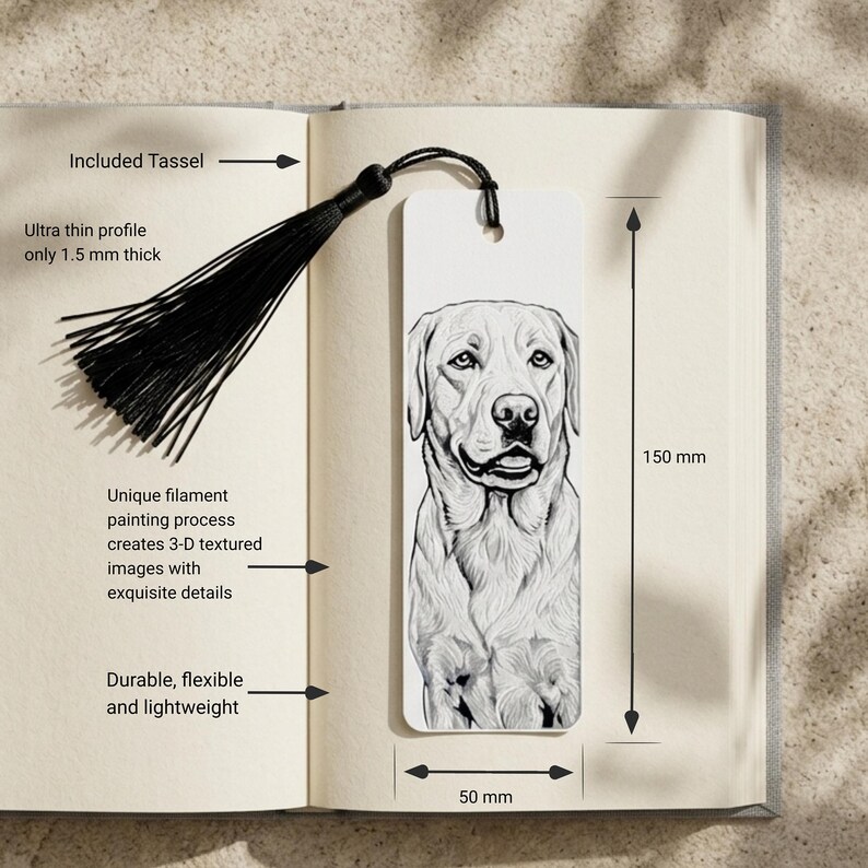 May include: A white rectangular bookmark featuring a detailed black and white illustration of a dog. The bookmark includes a black tassel, measures 150 mm in height by 50 mm in width, and has an ultra-thin profile of 1.5 mm thickness.