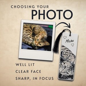 May include: A rectangular bookmark featuring a black and white illustration of a cat with the name Mischa and two heart icons printed on it. A black tassel is attached to the top. The text CHOOSING YOUR PHOTO, WELL LIT, CLEAR FACE, SHARP, IN FOCUS appears.