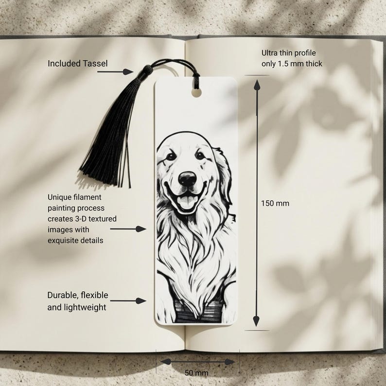May include: A white rectangular bookmark featuring a black and white illustration of a dog. The bookmark includes a black tassel, measures 150 mm in height and 50 mm in width, and has an ultra thin profile of 1.5 mm thickness with a 3-D textured surface.