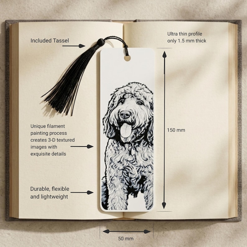 May include: A white rectangular bookmark featuring a black and white illustration of a dog with a curly coat. The bookmark includes a black tassel, measures 150 mm by 50 mm, and has an ultra-thin profile of 1.5 mm. It is durable, flexible, and lightweight.