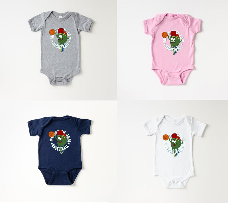May include: Four baby onesies in grey, pink, navy blue, and white. Each onesie features a cartoon character with a basketball and the words "Monster Jam Basketball" in a circular design. The character is green with a red hat.