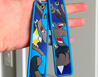 Anime-sleutelhanger geborduurde Jet Tag