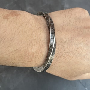 Norse and Celtic-inspired bracelets for men: Viking bangle with runes, torc, and Celtic cuff