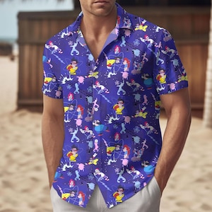 May include: A short-sleeved button-down shirt in a vibrant blue, covered in a repeating cartoon pattern. The design features figures in action poses, with elements of science and energy. The shirt has a classic collar and is made of a lightweight fabric.