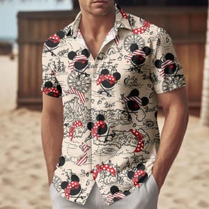 May include: Beige short-sleeved shirt with a pirate-themed pattern. The design features cartoon mouse characters with pirate bandanas and eye patches, along with nautical maps, compasses, and ships.