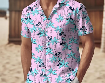 May include: A pink button-up shirt with a short sleeve featuring a repeating pattern of Mickey Mouse surfing on a surfboard in front of palm trees.