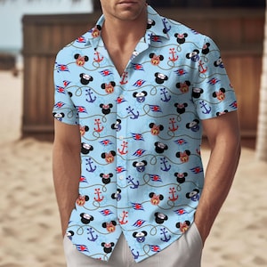 May include: Light blue short-sleeved shirt featuring a pattern of Mickey and Minnie Mouse heads, anchors, and cruise ship logos. The shirt is made of a lightweight fabric. The design includes red, black, and white accents, ideal for warm weather.