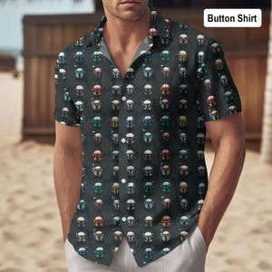 May include: Short-sleeved button-down shirt featuring a repeating pattern of colourful helmet designs on a dark background. The shirt has a classic collar. The text "Button Shirt" is visible in the upper right corner.