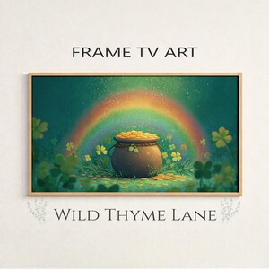 May include: A framed digital art print featuring a pot of gold at the end of a rainbow, surrounded by shamrocks. The artwork has a green and gold color scheme, with the text "FRAME TV ART" and "WILD THYME LANE".